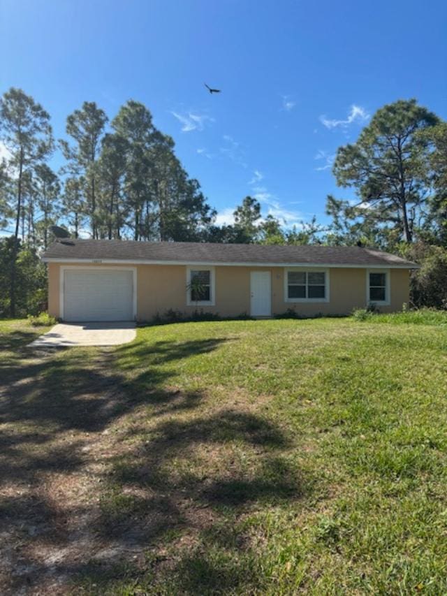 ranch-style home with a front lawn, an attached garage, dirt driveway, and stucco siding