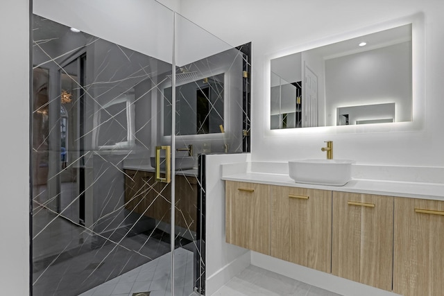 bathroom featuring vanity and a marble finish shower