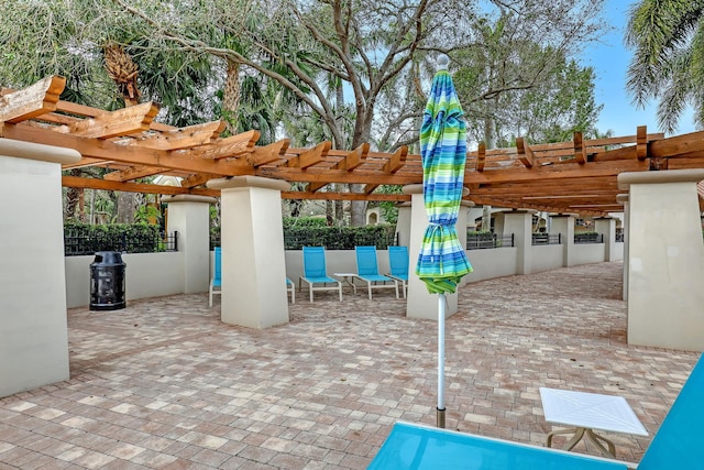 view of patio / terrace featuring fence and a pergola