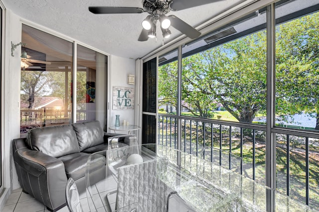 sunroom with ceiling fan and a healthy amount of sunlight