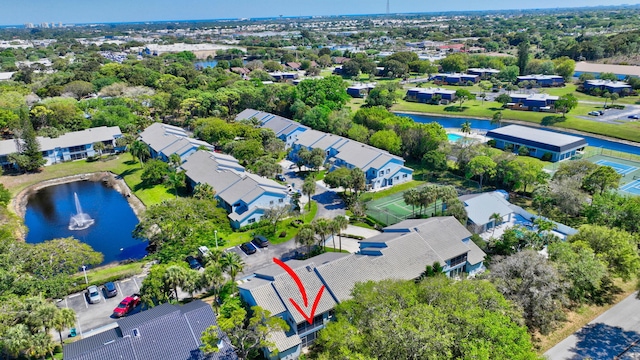 birds eye view of property with a residential view and a water view