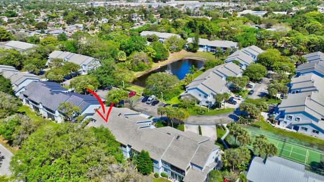 drone / aerial view featuring a water view and a residential view