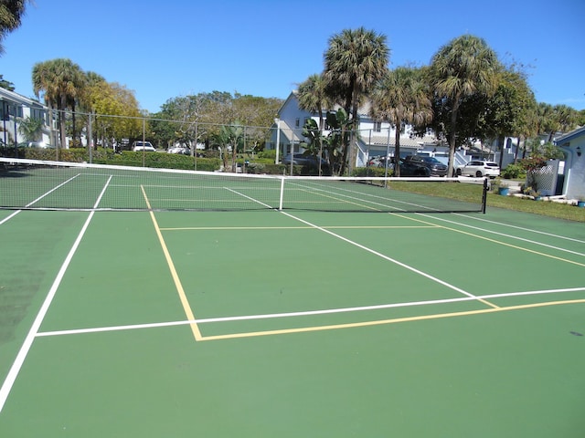 view of sport court featuring fence