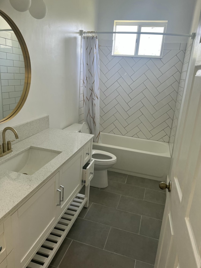 full bathroom with vanity, shower / bath combo with shower curtain, tile patterned flooring, and toilet