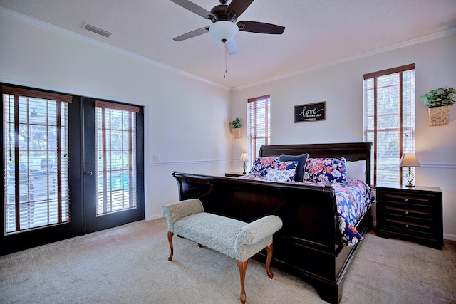 bedroom featuring crown molding, visible vents, carpet flooring, and french doors