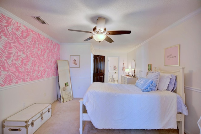 bedroom with light carpet, visible vents, connected bathroom, a textured ceiling, and crown molding