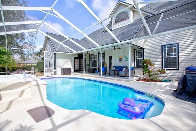 pool with an outdoor hangout area, a patio, a lanai, and a ceiling fan