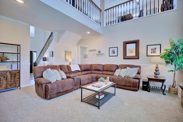 living room featuring recessed lighting, carpet flooring, baseboards, stairs, and crown molding