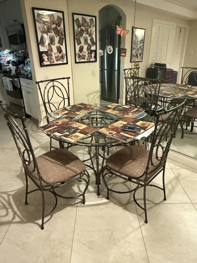 dining area with arched walkways