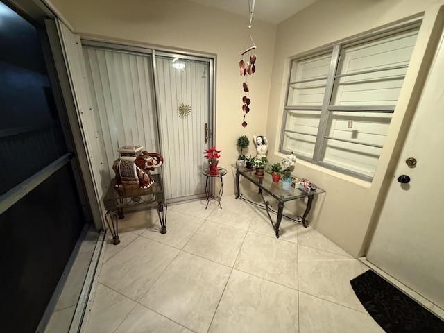 doorway featuring light tile patterned floors