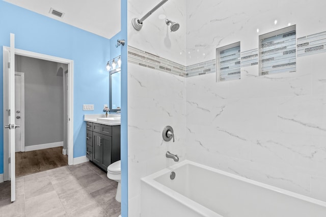 bathroom with visible vents, toilet, shower / bathing tub combination, baseboards, and vanity