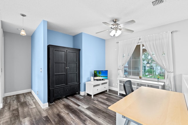 office area with visible vents, a ceiling fan, baseboards, and dark wood-style flooring