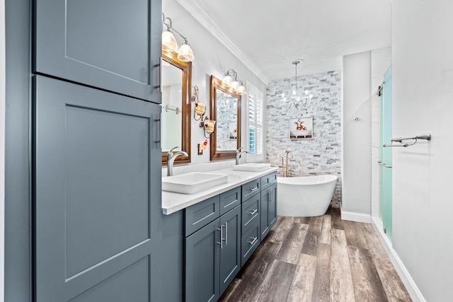 full bathroom featuring a stall shower, a sink, wood finished floors, double vanity, and a soaking tub