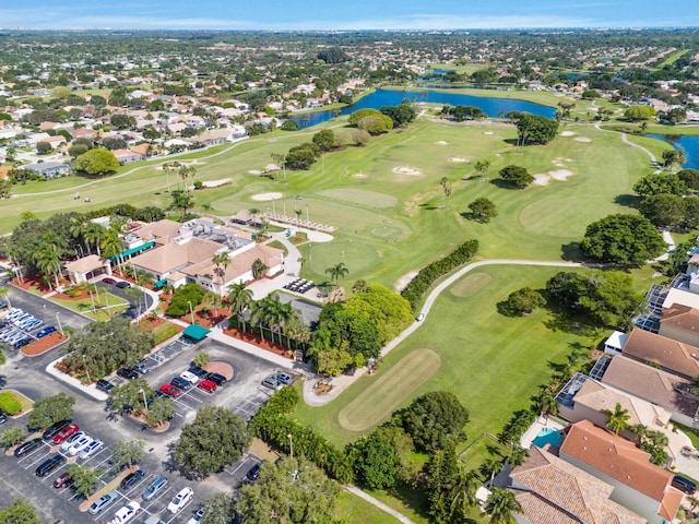 bird's eye view featuring golf course view and a water view