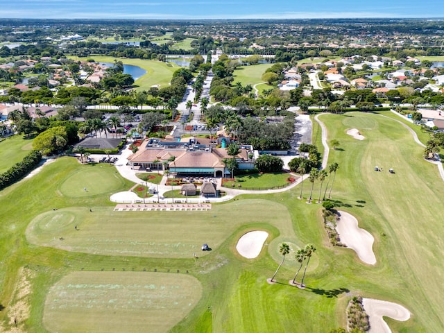 aerial view featuring view of golf course and a water view