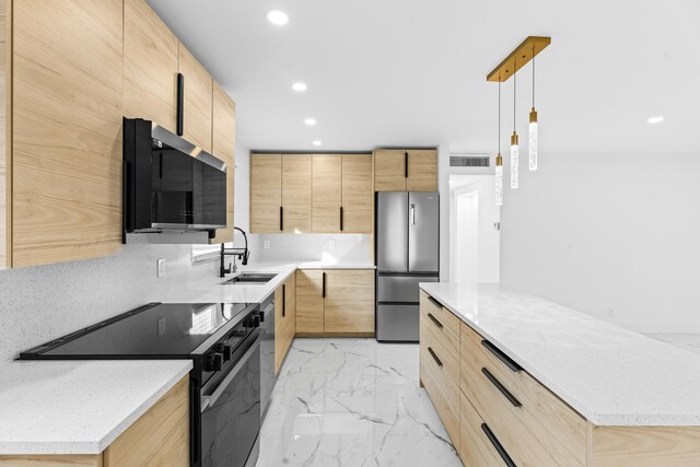 kitchen with modern cabinets, marble finish floor, stainless steel appliances, light brown cabinets, and a sink