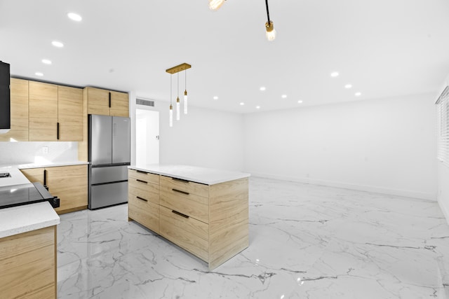 kitchen featuring recessed lighting, light countertops, freestanding refrigerator, light brown cabinetry, and modern cabinets