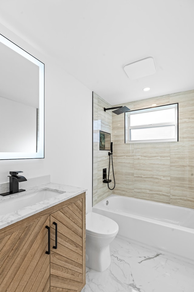 bathroom with marble finish floor, tub / shower combination, vanity, and toilet