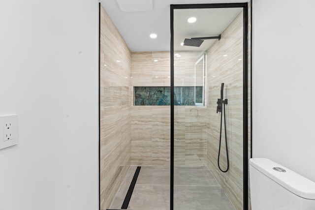 full bathroom featuring recessed lighting, toilet, and a walk in shower