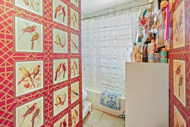 bathroom featuring tile patterned floors, toilet, and shower / bathtub combination with curtain