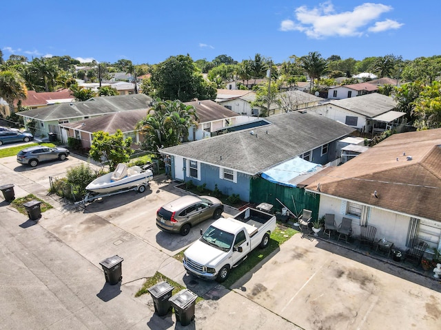 birds eye view of property with a residential view