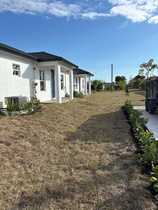 view of yard with central AC