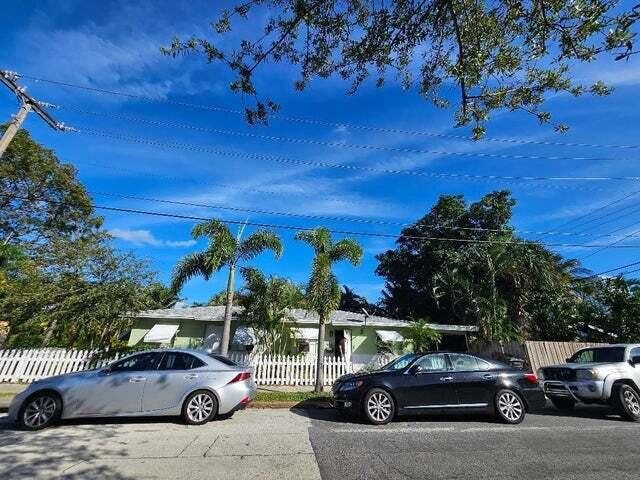 view of parking with fence