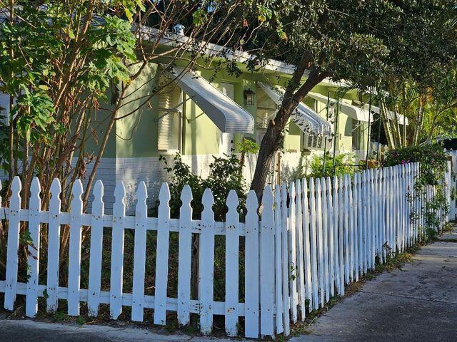 view of property exterior featuring fence