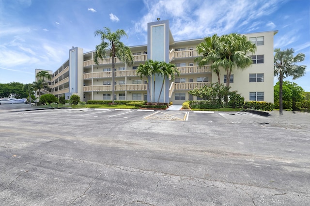 view of property featuring uncovered parking