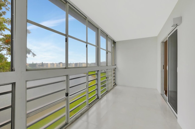 sunroom featuring a city view