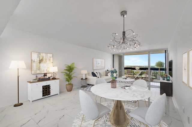 dining room with baseboards, marble finish floor, expansive windows, and a notable chandelier