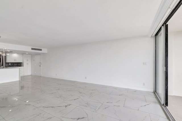 interior space with marble finish floor, visible vents, and baseboards