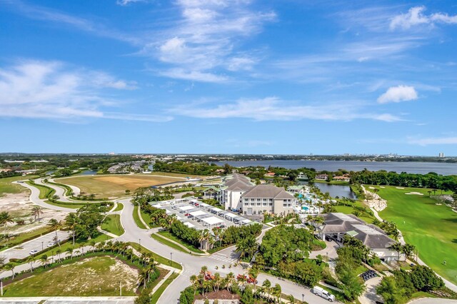 aerial view with a water view and view of golf course