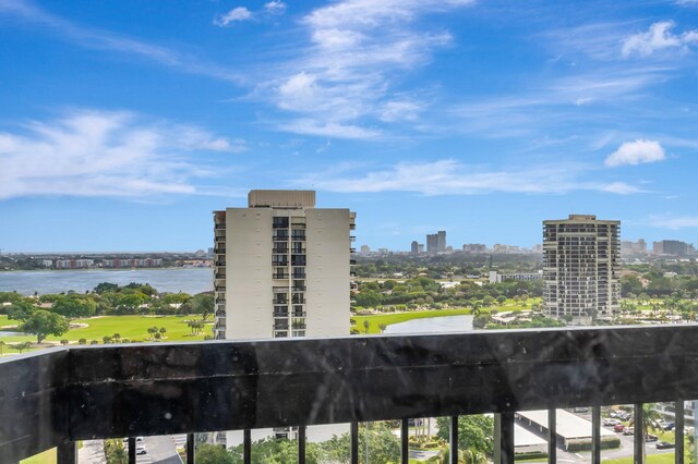 balcony with a view of city and a water view