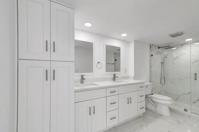 bathroom with marble finish floor, visible vents, a sink, and toilet