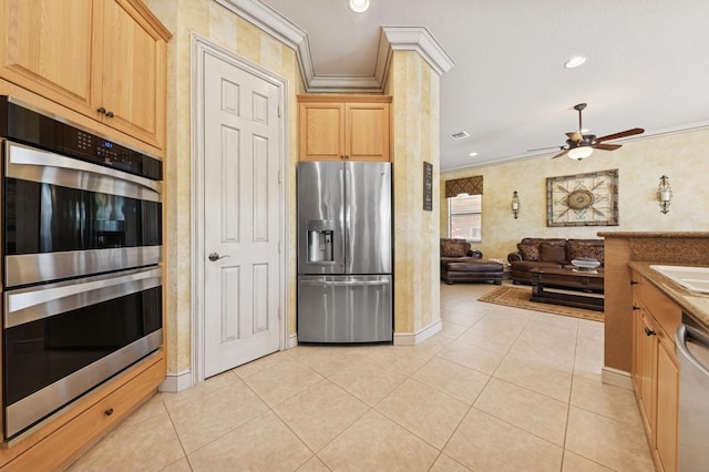 kitchen featuring light tile patterned floors, stainless steel appliances, a ceiling fan, and ornamental molding