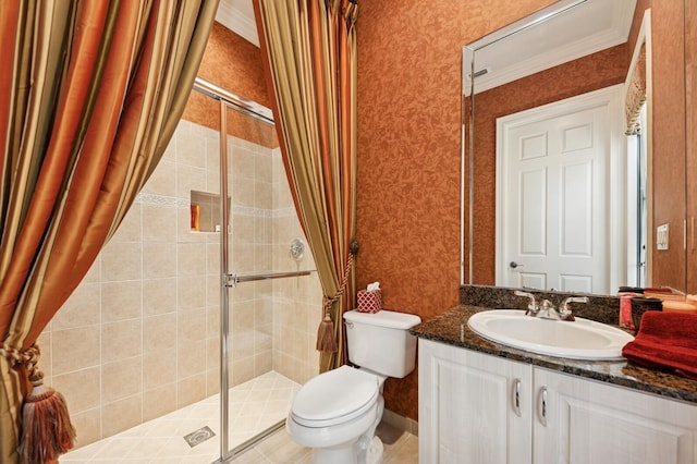 bathroom featuring vanity, wallpapered walls, a stall shower, crown molding, and toilet