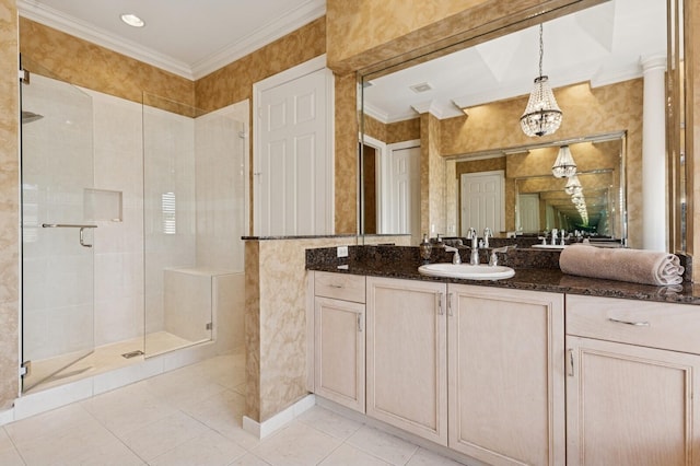 full bath featuring a notable chandelier, ornamental molding, a shower stall, tile patterned flooring, and vanity