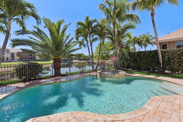 view of pool featuring a fenced backyard and a pool with connected hot tub