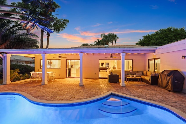 outdoor pool featuring an outdoor hangout area, a patio area, area for grilling, and a ceiling fan