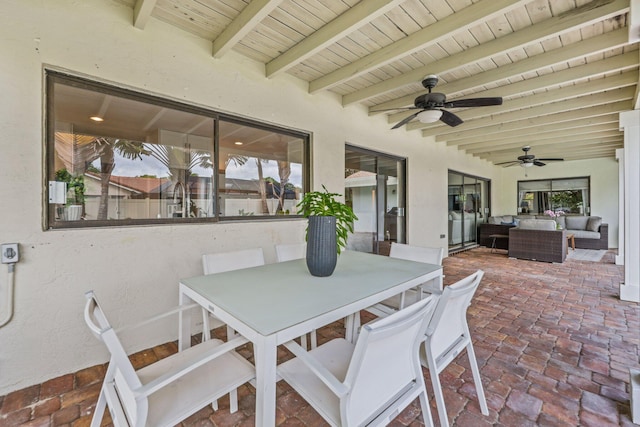 view of patio / terrace featuring outdoor dining area, ceiling fan, and an outdoor hangout area