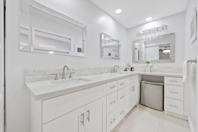 bathroom featuring double vanity, tile patterned flooring, a sink, and recessed lighting