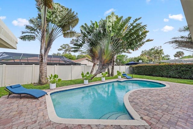 view of pool with a yard, a fenced backyard, a fenced in pool, and a patio