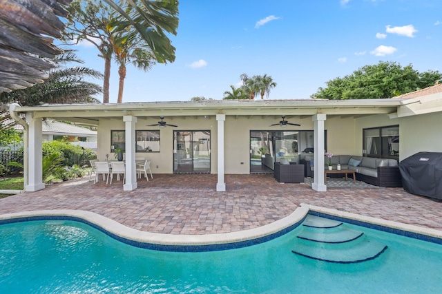 outdoor pool featuring ceiling fan, a patio, and outdoor lounge area