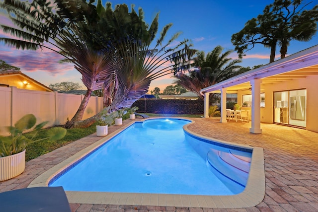 view of pool featuring a fenced in pool, a fenced backyard, and a patio