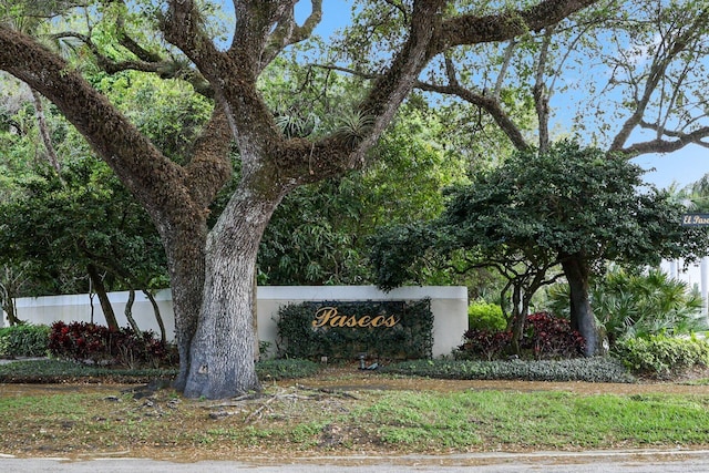 community sign featuring fence