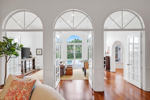 entryway with french doors and wood finished floors