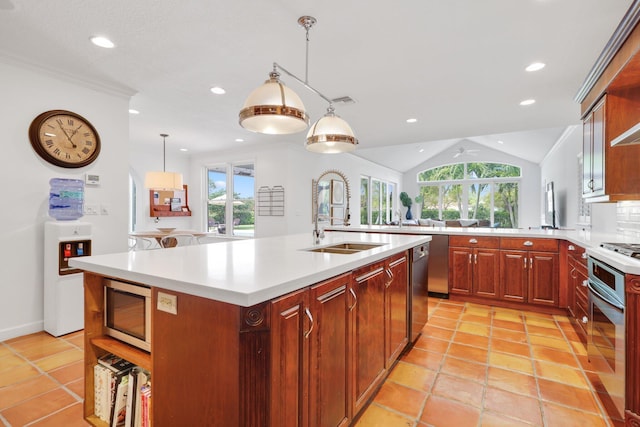 kitchen with stainless steel appliances, light countertops, a sink, and open shelves