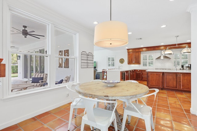 dining room with light tile patterned floors, visible vents, baseboards, ornamental molding, and recessed lighting