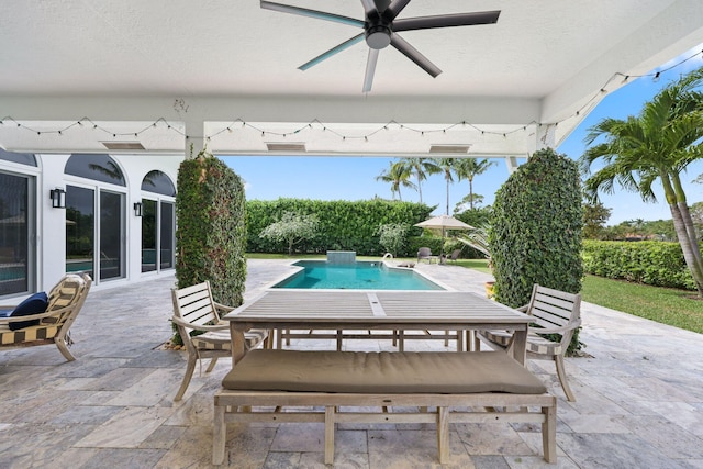 view of patio featuring an outdoor pool, ceiling fan, and outdoor dining area